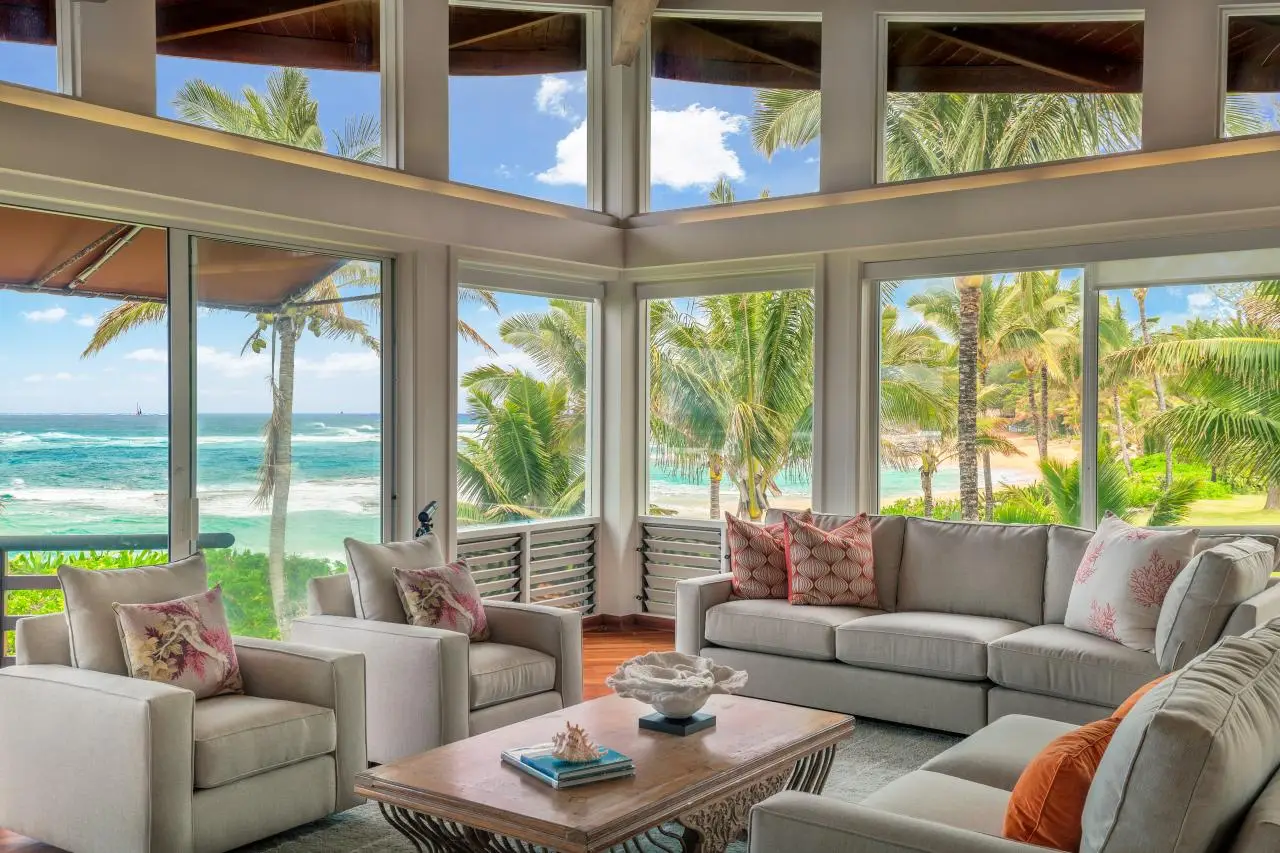 South Florida living room with floor-to-ceiling hurricane impact windows overlooking the ocean