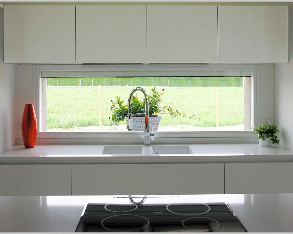 Large sliding impact glass door system opening to a patio